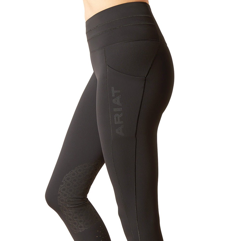 Black leggings with 'Ariat' branding on a white background