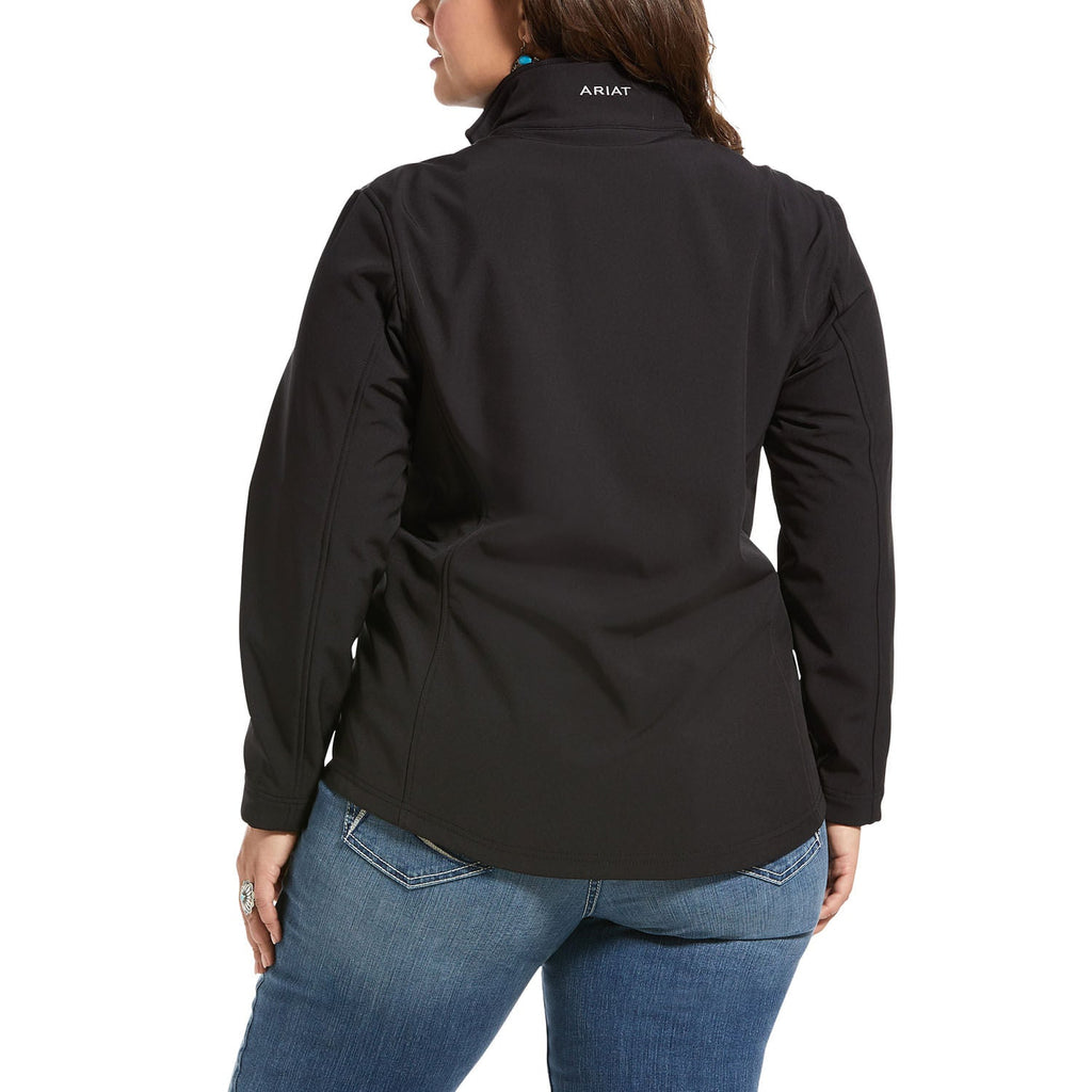 Person wearing a black jacket with 'Ariat' branding on a white background