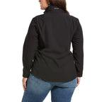 Person wearing a black jacket with 'Ariat' branding on a white background