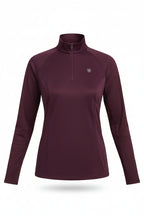 Woman wearing a purple long-sleeve athletic shirt with a logo on a white background