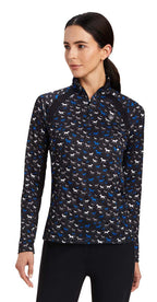 Woman wearing a patterned long-sleeve shirt with a white background