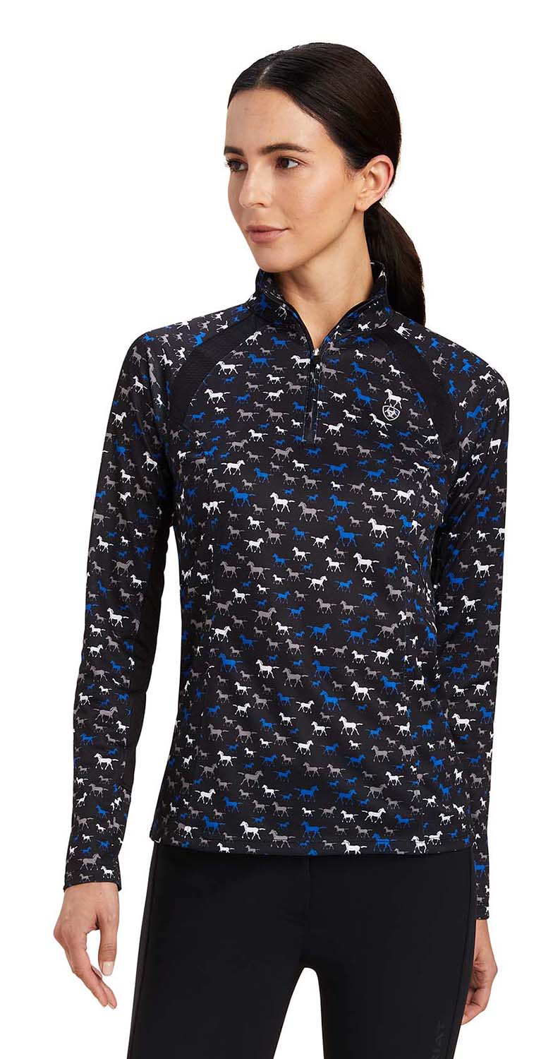 Woman wearing a patterned long-sleeve shirt with a white background