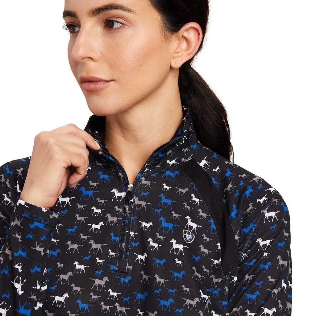 Woman wearing a black jacket with horse pattern on a white background