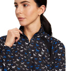 Woman wearing a black jacket with horse pattern on a white background