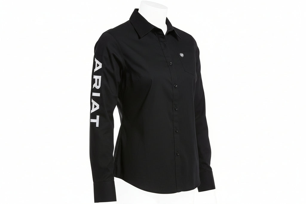 Person wearing a black shirt with 'Ariat' branding on a white background