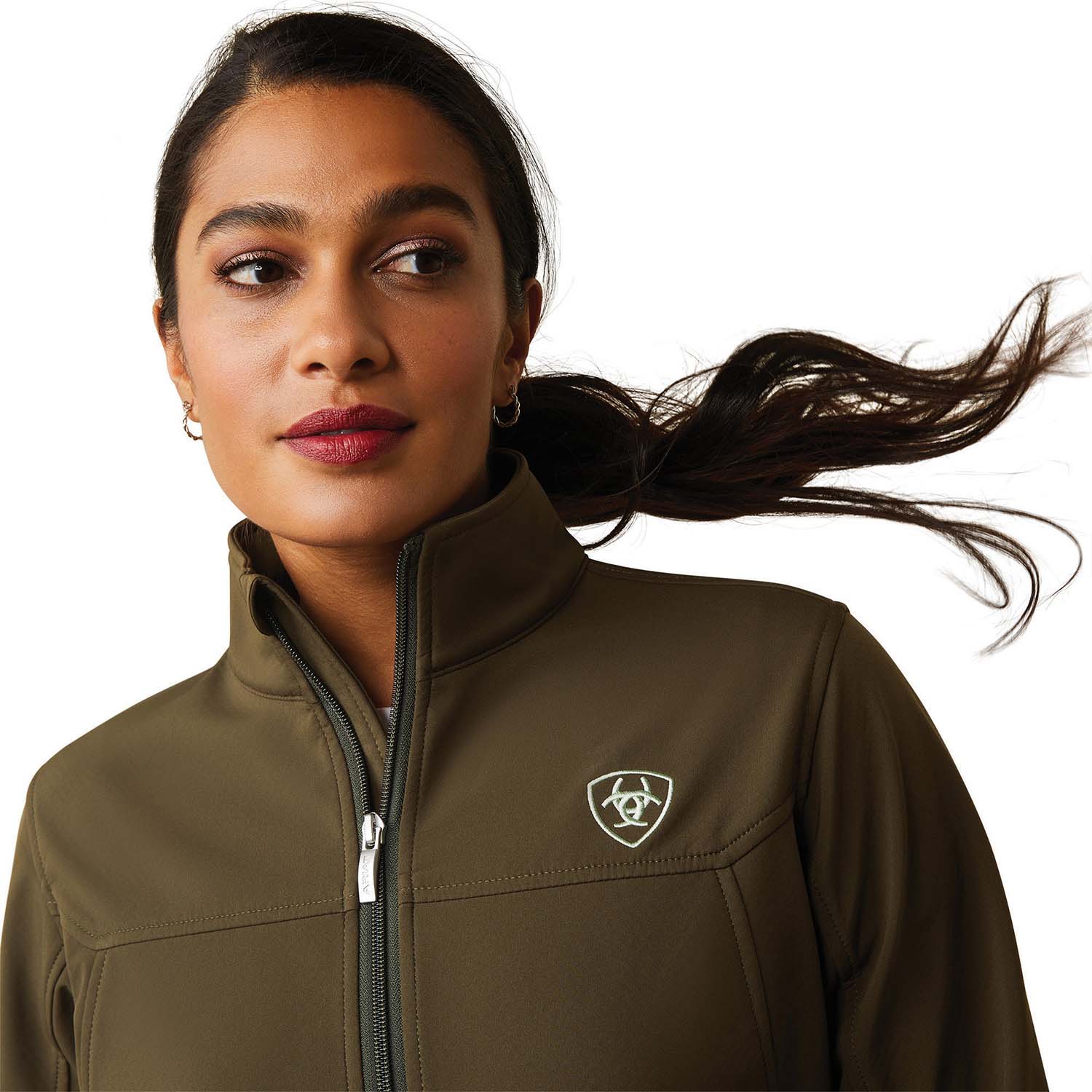 Woman wearing a brown jacket with a logo on a white background