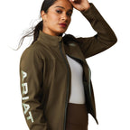 Woman wearing a brown Ariat jacket on a white background