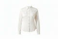 Woman wearing a white shirt with a bolo tie and dark jeans on a white background