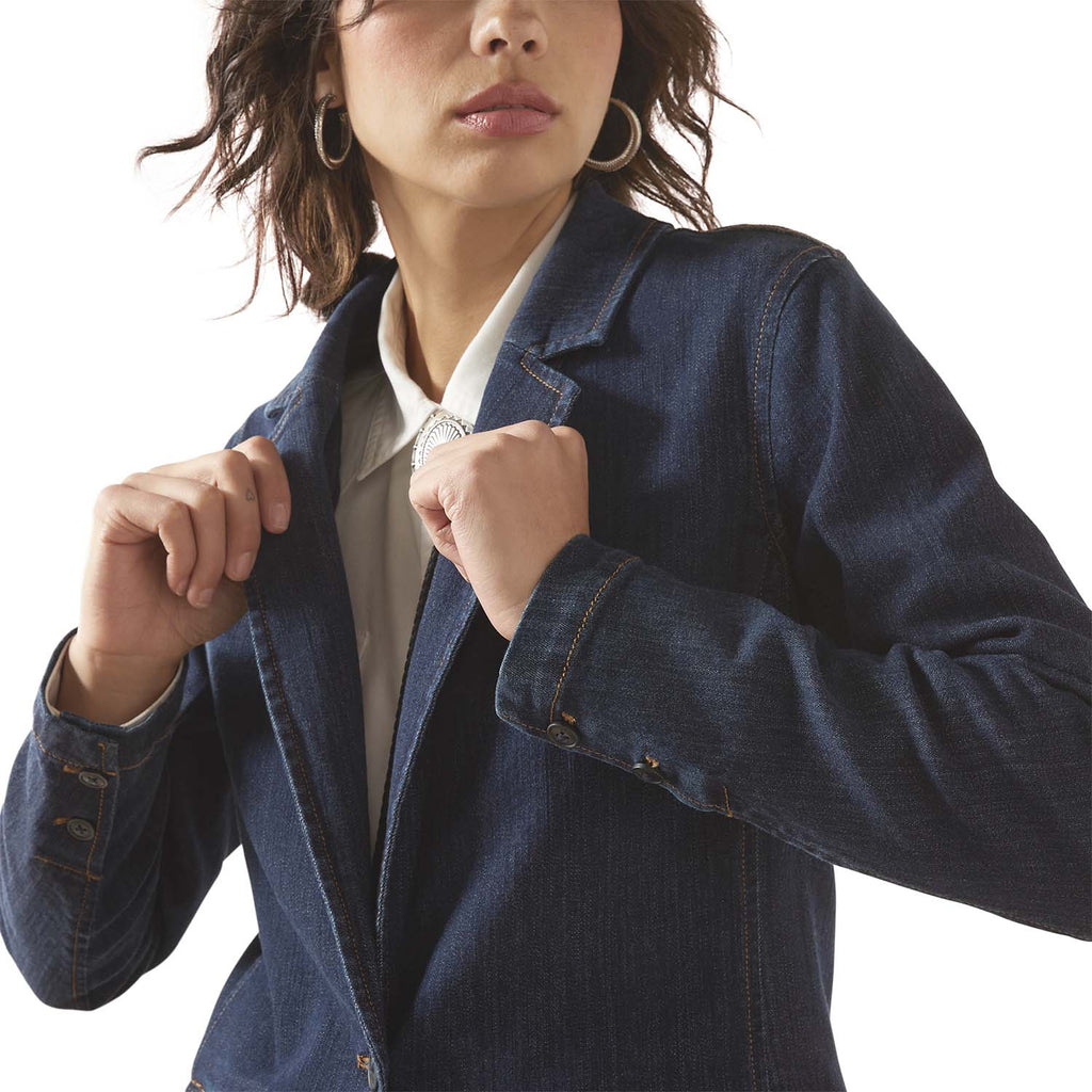 Woman wearing a blue denim jacket on a white background