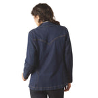 Person wearing a blue denim jacket on a white background