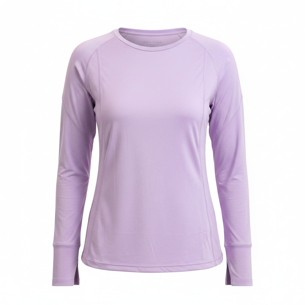Woman wearing a light purple long-sleeve top with colorful leggings on a white background