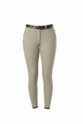 Person wearing beige riding pants with a white top on a white background