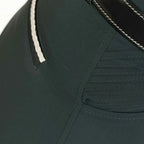 Close-up of a dark green equestrian saddle pad with white stitching.