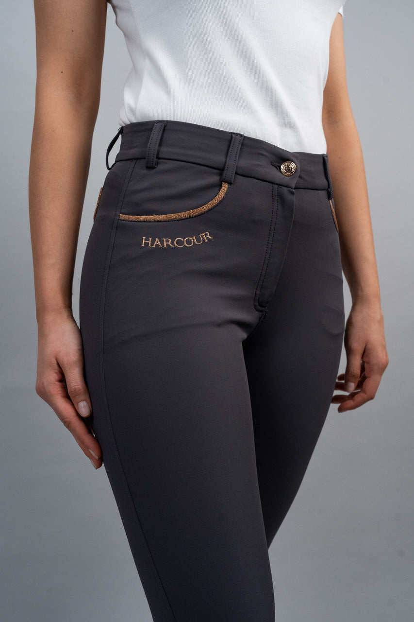 Dark gray riding pants with 'Harcour' branding on a gray background