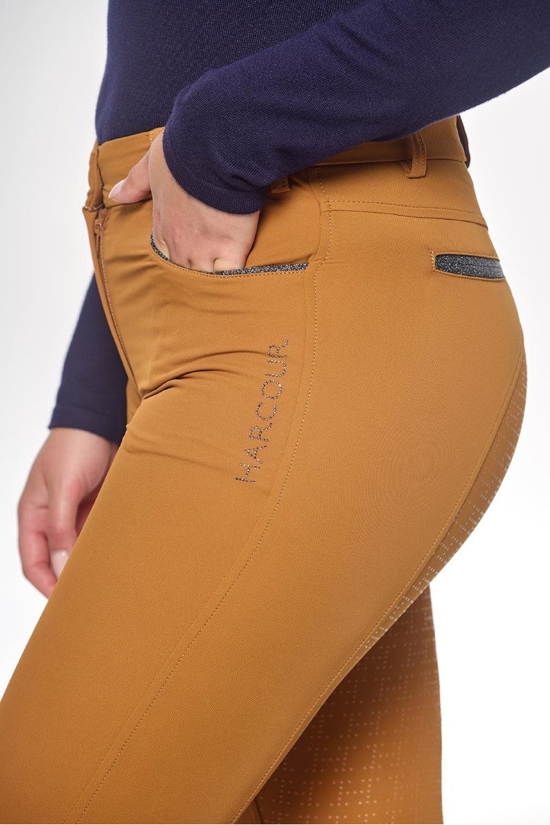 Brown riding pants with 'Harcour' branding on a white background