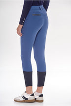 Blue riding pants with a white background