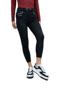 Person wearing black riding pants with a visible brand logo on a gray background