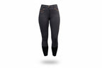  dark gray riding pants with white sneakers on a gray background