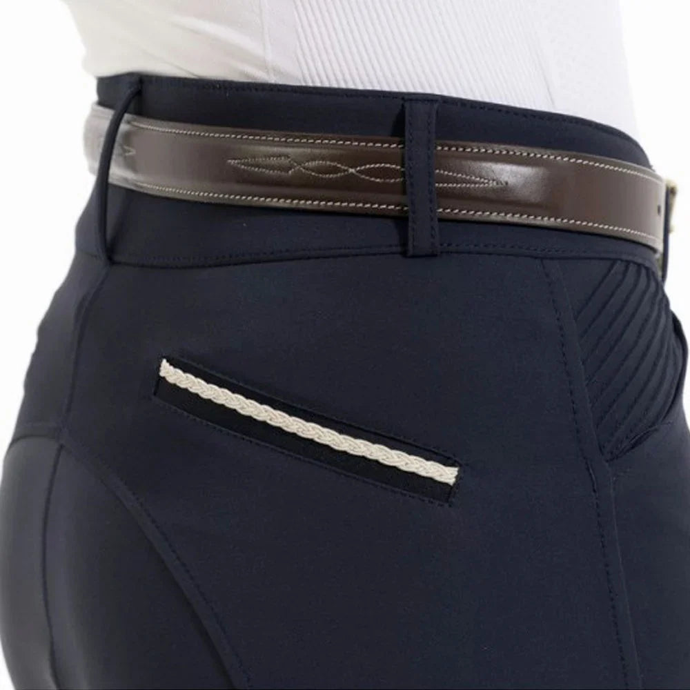 Navy riding pants with a brown belt and white stitching on a white background