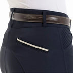 Navy riding pants with a brown belt and white stitching on a white background