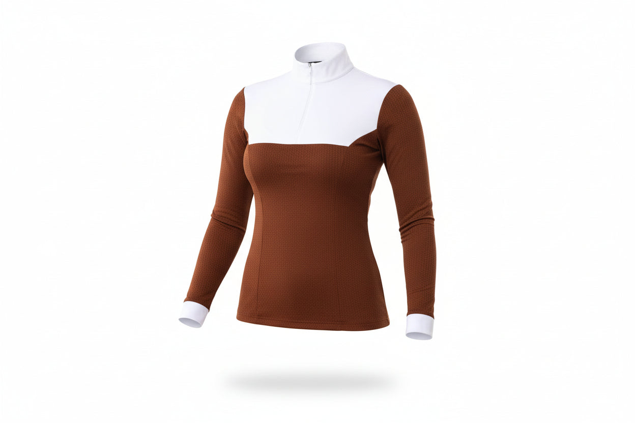 brown and white equestrian top with beige pants on a white background