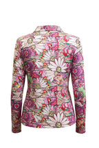 Woman wearing a colorful floral patterned jacket on a white background