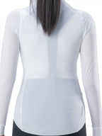 White long-sleeve athletic top worn by a person on a white background
