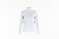 Woman wearing a white long-sleeve top with black accents and white pants on a white background