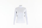 Woman wearing a white long-sleeve top with black accents and white pants on a white background