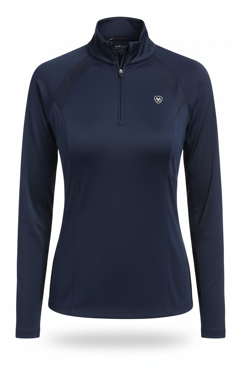 Woman wearing a navy long-sleeve top and pants with a belt, on a white background
