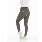 Person wearing gray riding pants on a white background