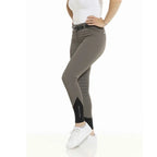 Person wearing gray riding pants with a white background