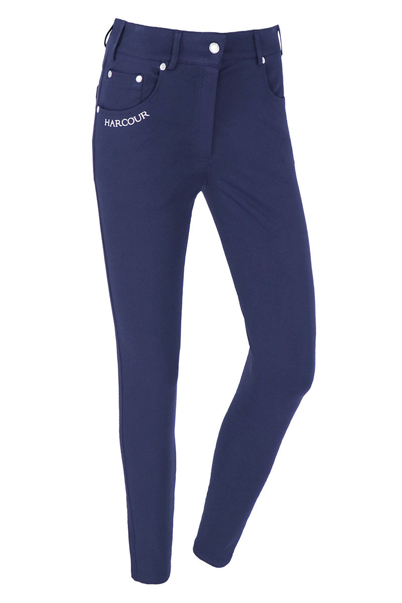 Navy blue riding pants with white buttons on a white background
