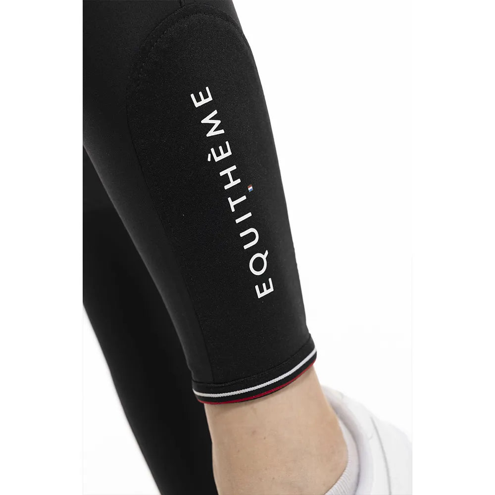 Black legging with 'EQUITHEME' branding on a white background