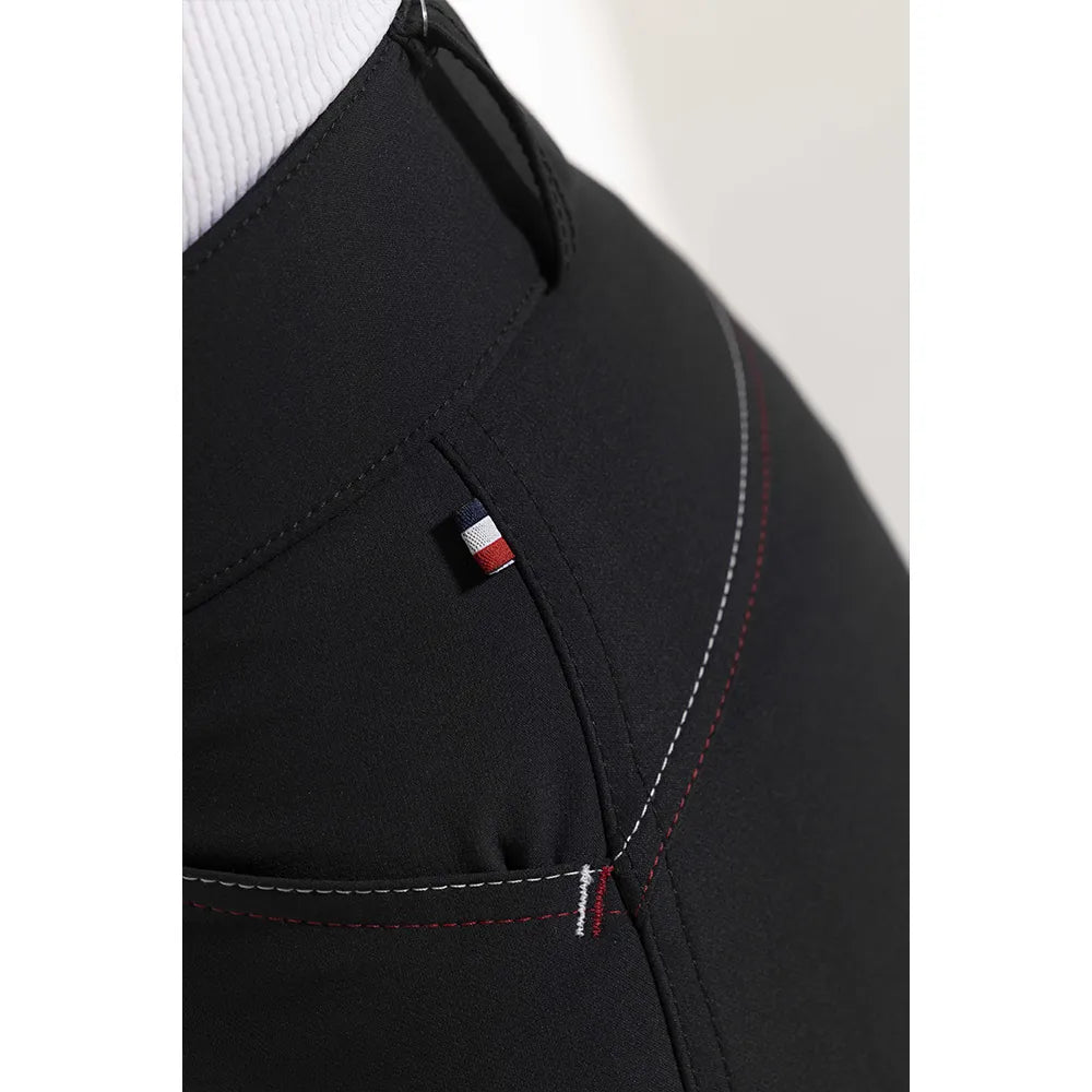 Close-up of a black jacket with a brand logo on a white background