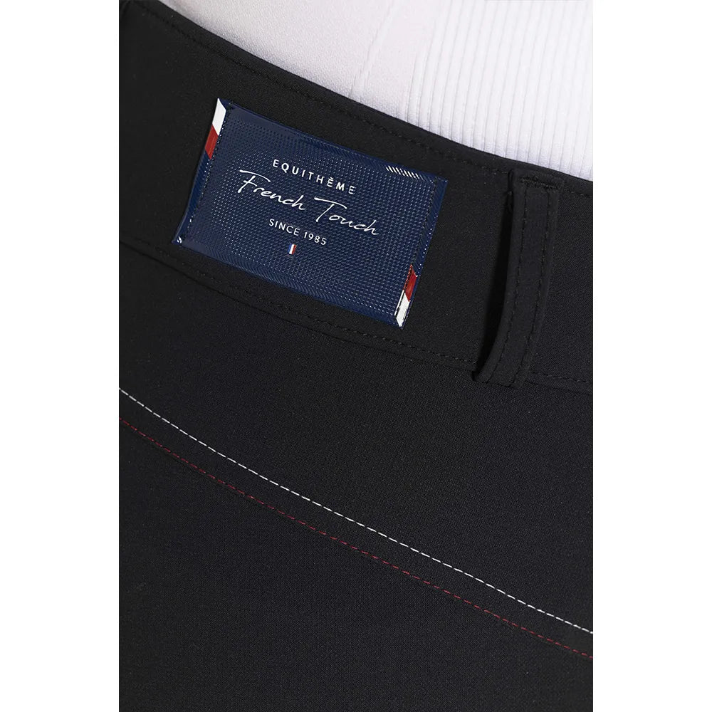 Black pants with a brand label on a white background