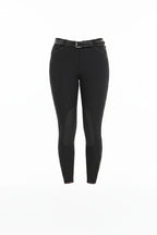 Person wearing black riding pants on a white background